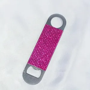 Close-up of a pink glitter rhinestones flat bottle opener