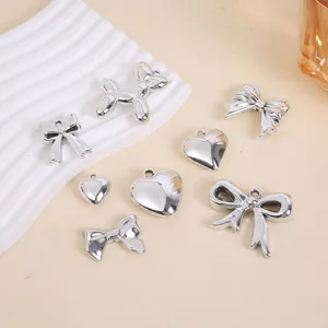 Assorted silver UV plated 3D heart and bow charms for DIY jewelry making crafts.