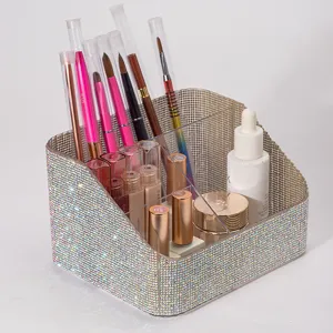 Detail view of multi-compartment desktop makeup brush organizer with full rhinestone decor