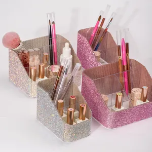 Detailed view of sparkly rhinestone-covered multi-compartment makeup brush organizers