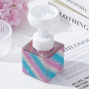 Detail view of a luxury rhinestone soap dispenser with a flower-shaped foaming pump head
