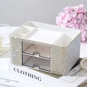 Detailed view of white rhinestone-studded 2-drawer desk organizer with compartments