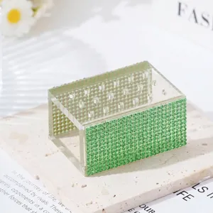 Close-up detail view of an 18-hole green rhinestone acrylic nail drill bit storage organizer.