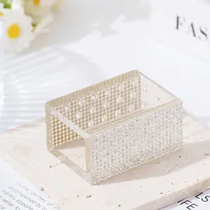 Close-up of 18-hole acrylic nail drill bit box with rhinestone decoration