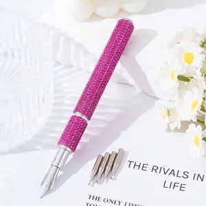 Close-up of pink rhinestone nail art fountain pen with five replaceable metal tips