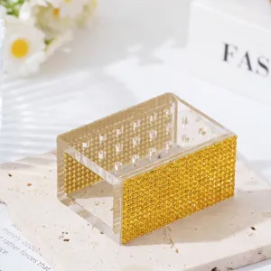 Detailed macro view of 18-hole acrylic nail drill bit organizer featuring yellow rhinestones