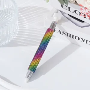 Detailed view of the dual-ended nail dotting pen with colorful rainbow rhinestones