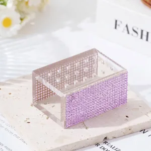 Macro view of 18-hole clear acrylic organizer box decorated with purple rhinestones