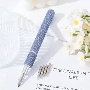 Close-up detail of blue rhinestone nail art pen showing 5 interchangeable functional metal tips