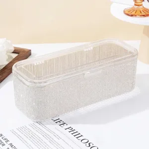 Elegant luxury diamond-encrusted makeup brush storage box featuring a clear dustproof lid