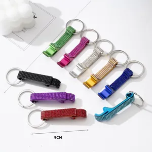 Close-up of colorful rhinestone-encrusted aluminum alloy bottle opener keychains, 9cm length