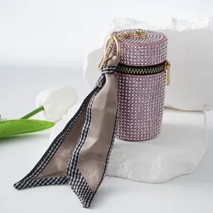 Luxury pink rhinestone cylinder coin purse featuring a chic silk scarf keychain charm