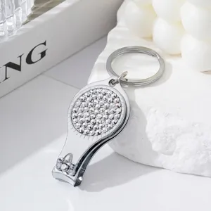 Rhinestone studded 2-in-1 nail clipper and bottle opener keychain in silver finish
