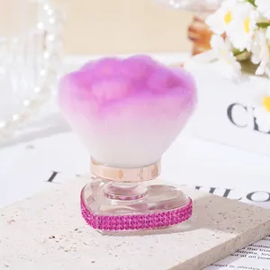 Elegant heart-shaped base makeup brush with pink rhinestones for loose powder and blush
