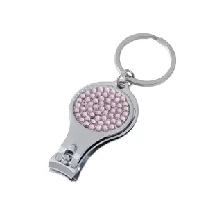 Multifunctional silver nail clipper bottle opener keychain with pink rhinestones decoration