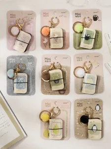 Cute mini PU leather notebook keychain pendant backpack accessory detailed design.