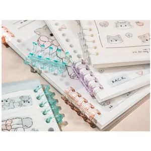 A5 B5 segmented loose-leaf notebook with cute cat illustrations and colorful plastic binder rings.