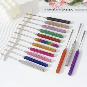 Variety of rhinestone-encrusted nail art spatulas in various vibrant colors for manicure