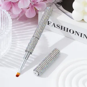 Detailed view of rhinestone-encrusted dual-ended nail art brush with flat tip
