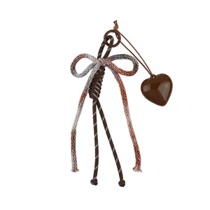 Vintage style woven cotton rope bow keychain with glossy brown resin heart bag charm