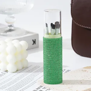 Chic green rhinestone makeup brush set with five soft brushes inside a clear cylinder case