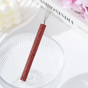 Detail showing the vibrant red rhinestone handle of the professional nail art line drawing tool.