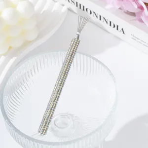 Close-up detail of multi-functional rhinestone spider gel nail tool for drawing lines