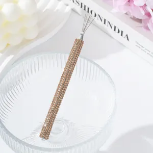 Detailed view of a luxury rhinestone-encrusted nail art tool for spider gel lines