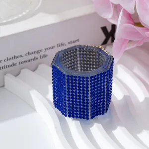 Detailed view of the blue rhinestone-encrusted hexagonal nail art dappen dish