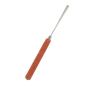 Stainless steel nail art mixing spatula with orange rhinestone handle for gel polish.