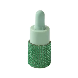 Elegant green rhinestone encrusted essential oil dropper bottle for travel and perfume