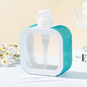 Detail of a luxury teal rhinestone-encrusted square refillable pump soap bottle