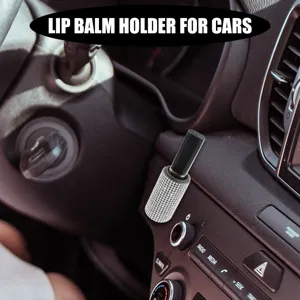 Detail view of a luxury rhinestone lip balm holder installed on a car dashboard console.