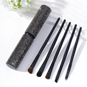 Detail view of 5-piece makeup brush set with sparkling rhinestone storage tube