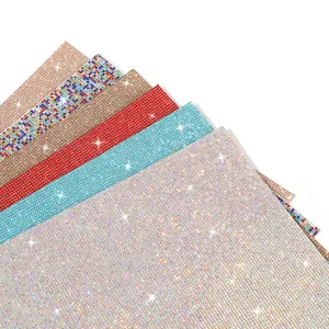 Detailed view of self-adhesive rhinestone sticker sheets in various sparkling colors.