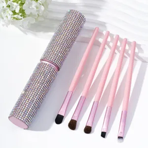 Detail view of pink makeup brush set with sparkling rhinestone-encrusted storage case