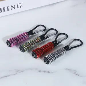 Four colors of portable rhinestone mini LED flashlights with secure carabiner clip