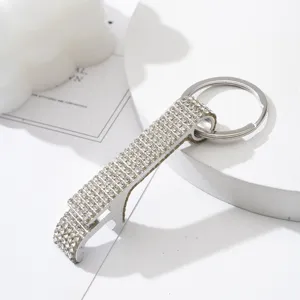 Close-up detail of silver rhinestone-encrusted aluminum alloy bottle opener keychain.