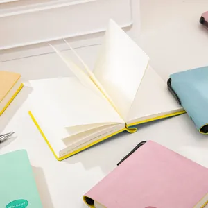 Portable mini pocket notebook for students, compact square journal with blank pages.