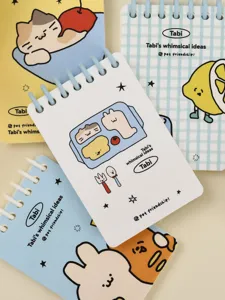 Detail of A7 cartoon ring-bound notebooks with whimsical illustrations and blue coils