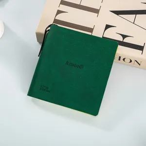 Portable mini square pocket notebook with green cover and clip for memo notes.