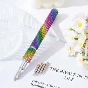 Close-up of a rainbow rhinestone nail art pen with five interchangeable metal tips