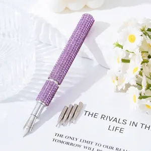 Close-up detail of a purple rhinestone nail art pen with 5 interchangeable metal painting nibs