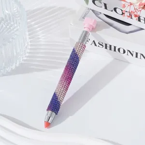 Detail view of a luxury rhinestone-studded dual-ended nail art dotting pen