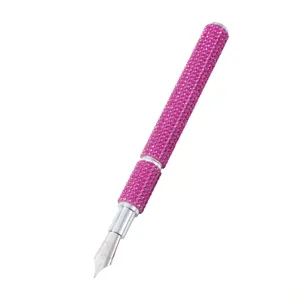 Luxury pink rhinestone encrusted nail art drawing pen with a fine silver nib detail