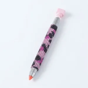 Sparkly purple rhinestone nail art dotting pen with dual-ended wax tip for picking crystals