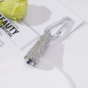 Mini LED flashlight with sparkling rhinestones and silver carabiner keychain detail