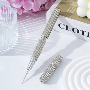 Close-up showing the sparkling silver rhinestone texture of a dual-ended nail art pen