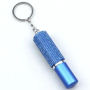 Close-up of blue rhinestone-studded 5ml portable perfume spray bottle keychain accessories