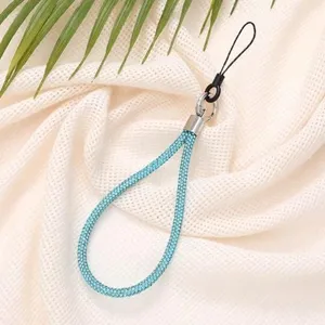 Close-up detail of 6mm blue rhinestone phone strap wristlet with a sparkling finish.